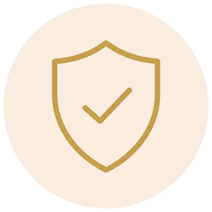 A minimalist gold shield icon with a checkmark inside, centered on a pale peach circular background.